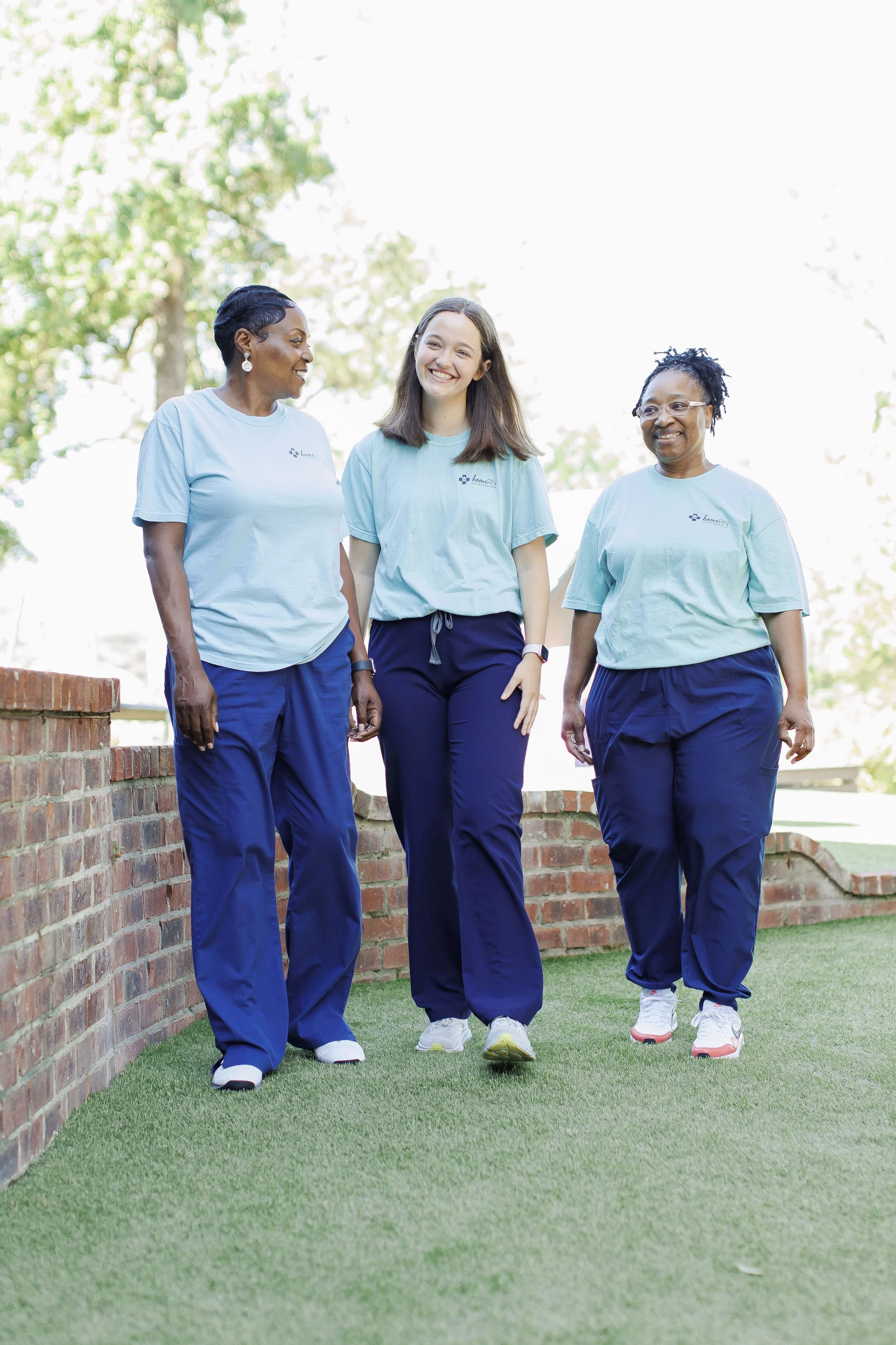 homeRN caregiver assisting elderly patient with daily activities